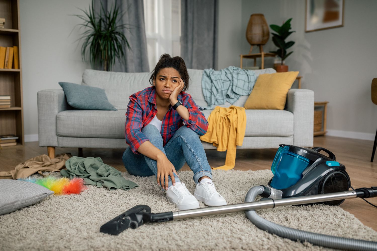 woman tired and unhappy after trying to clean carpet
